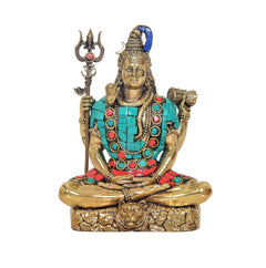 Brass Shiva idol sculpture front view, blue topknot, turquoise necklace and red belt