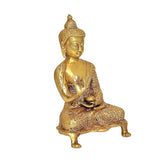 Brass Buddha statue with Abhaya mudra, seated in prayer, angled view, 9 in