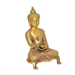 Brass Buddha statue with Abhaya mudra, seated in prayer, angled view, 9 in
