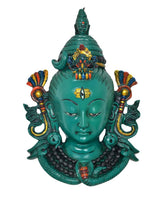 Green resin Shiva head mask statue, front view with colorful crest and ear ornaments