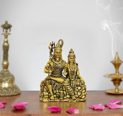 Golden brass Shiva and Parvati idol, seated on lotus-style base, height 3.5 in