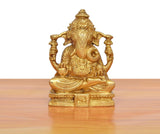 Brass Ganpati Bappa murti from front, detailed face, seated posture, golden