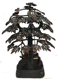 Brass Krishna and Radha swing on carved tree trunk, peacock top, hanging bead garlands