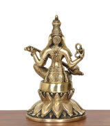 Brass Saraswati idol back-left angle, seated with veena and raised left hand