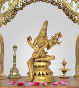 Handcrafted brass Maa Saraswati idol, seated holding a veena on an ornate base