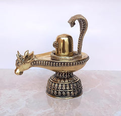 Brass Shiva ling with Nandi head extending to the side, engraved pedestal details