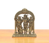 Brass Ram Darbar figurines—Ram standing center, Sita and Lakshman flanking, arched frame