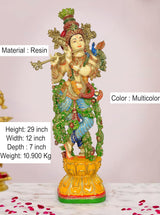 Hand-painted Krishna playing flute statue in multicolor resin, side view