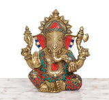 Brass Ganpati Bappa murti, gold-toned face and multicolor jeweled garments, seated