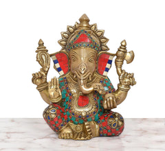 Brass Ganpati Bappa murti, gold-toned face and multicolor jeweled garments, seated