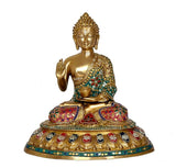 Brass Buddha statue seated in blessing pose, teal and multicolor jeweled robe
