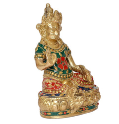Kuvera brass statue from side view, green-and-red decorated clothing, gold carved face