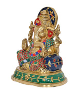 Brass Ganesha statue, side view with jeweled ornaments and blue accents on robe