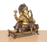 Brass Ganpati idol seated pose, visible side profile and ornamental belt on base