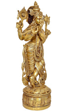 Krishna brass statue playing flute, rear three-quarter view with ornate headdress and base
