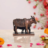 Copper cow statue with calf, side profile, raised patterns on the decorated body panels