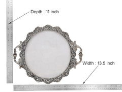 Ornate round silver tray with filigree border, measuring depth view