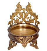 Brass peacock design urli bowl with ornate openwork top and carved legs