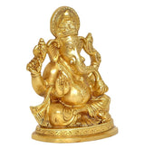 Brass Lord Ganesha idol statue, side view with lifted arms and carved engravings.