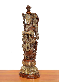 Brass Radha murti, angled view with detailed back ornaments and halo-like disc, on base