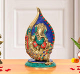 Brass Ganesha conch murti, blue mosaic back, multicolor accents, seated on base