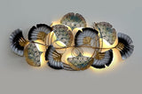 AONA metal wall hanging with glowing leaf and filigree panels in teal and gold