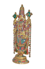 Ornate brass Tirupati Bala Ji showpiece, three-quarter view with colorful jewel accents
