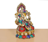 Angled view: Brass Ganesha seated on lotus, multicolor beaded jewelry