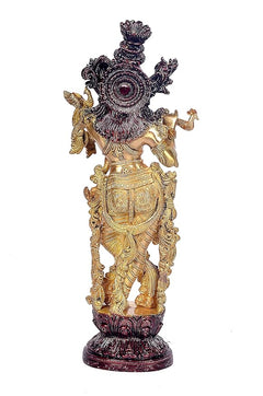 Back view brass Krishna playing flute idol with spoked headdress and winged ornaments on base