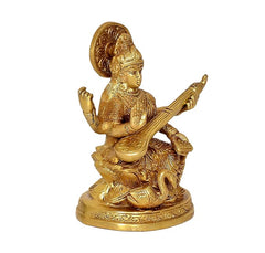 Brass Saraswati seated, angled view with veena and raised hand gestures