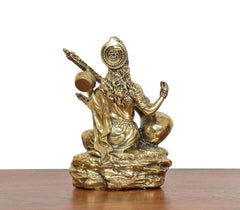 Brass Maa Saraswati statue side view, seated holding veena on lotus base