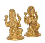 Brass Ganesha and Lakshmi idol statues, close front view, seated on lotus bases