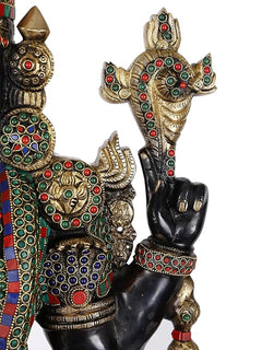 Brass idol hand and arm detail with gold patterns, bead borders, and multicolour jewel accents