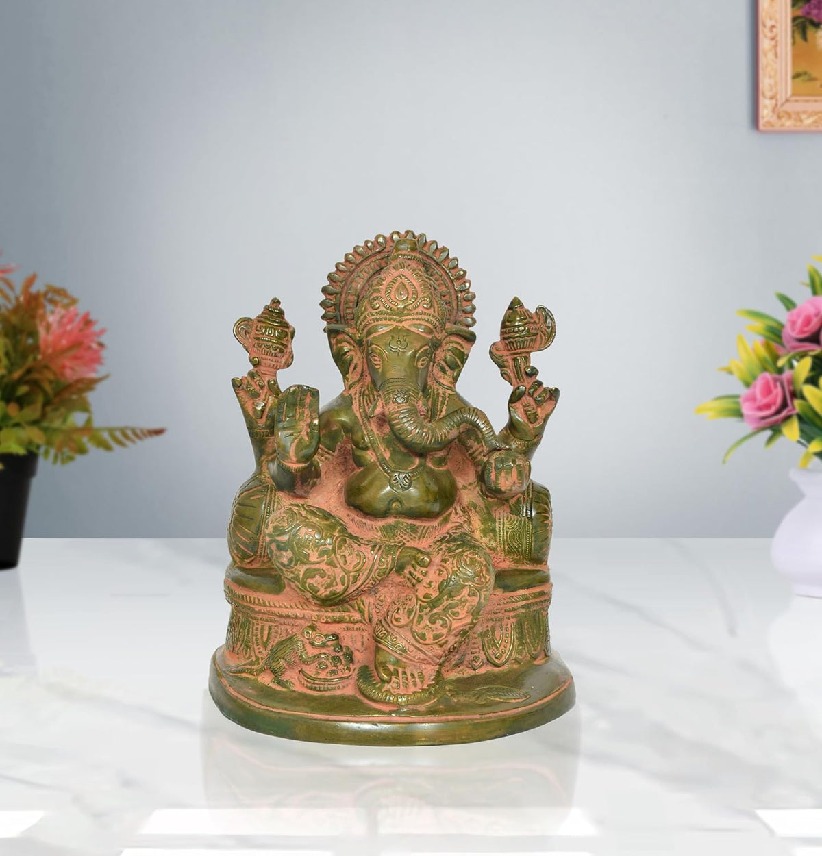 Brass green Ganesh sculpture, front view, seated figure with ornate details and base