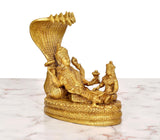 Golden brass Vishnu and Lakshmi idol with multi-hood serpent canopy