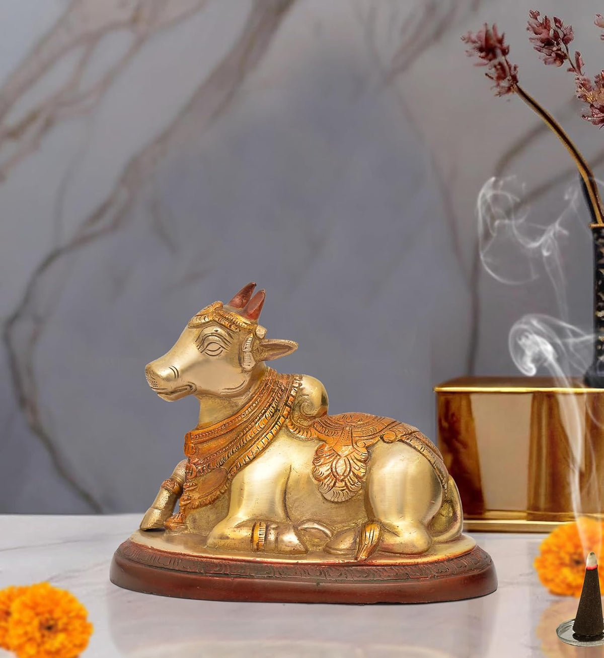 Brass Nandi bull statue, seated with ornate headgear and jewelry, for pooja decor