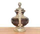 Brass decorative teapot, tall lid finial and central sculpted figure on front body