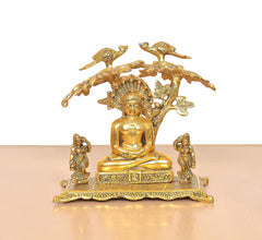 Mahavir Swami metal idol front view, seated monk under decorative canopy