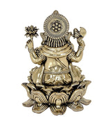 Back view brass Ganesha statue with circular halo motif and lotus base