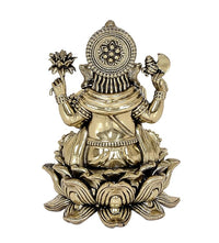 Back view brass Ganesha statue with circular halo motif and lotus base