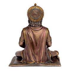 Resin Hanuman idol from behind, draped robe and spiked crown, seated on pedestal