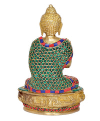 Back view brass Buddha statue with blue-green patterned robe and jewel trim
