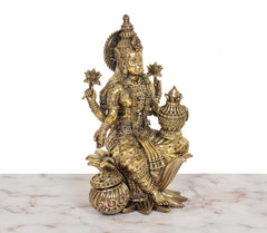 Superfine Brass Lakshmi idol, seated with pot-like object and intricate arm jewelry