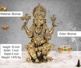 Bronze-colored Lord Ganesha idol, seated with patterned dhoti and jeweled ornaments