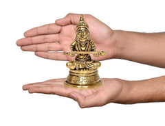 Brass Maa Annapurneshwari murti shown in hands, 4.5 inches