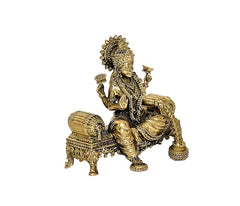 Angled view brass Lakshmi statue seated on lotus-style pedestal
