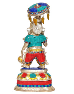 Back view of brass Ganpati showpiece with umbrella canopy, teal and red clothing
