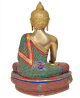 Back view of brass meditating Buddha statue, teal red patterned robe, ornate seated base