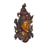 Tara wall hanging mask in bronze and gold, side angle showing raised ear ornaments