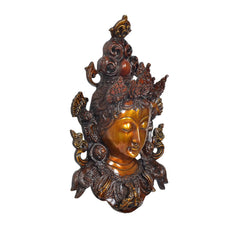 Tara wall hanging mask in bronze and gold, side angle showing raised ear ornaments